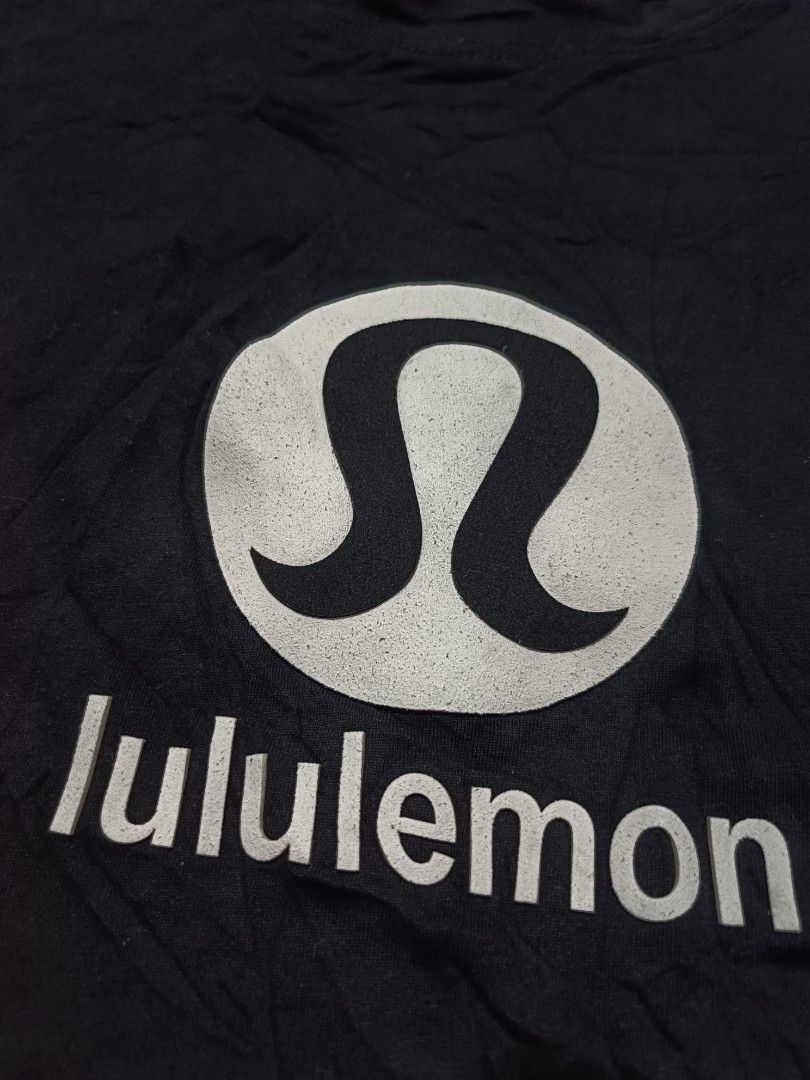 Lululemon Black T-Shirt with Large Logo (Category: Tshirts & Polo Shirts ) located in Barotac Nuevo. Submitted by gray101 (Listing ID 1470681044, Image 3). Description: - Brand: Lululemon - Color: Black with white chest logo graphic - Size: Large - Design: Classic crew neck, short sleeve - Material: Soft cotton blend - Origin: Made in Indonesia (CA35801 / RN106259).