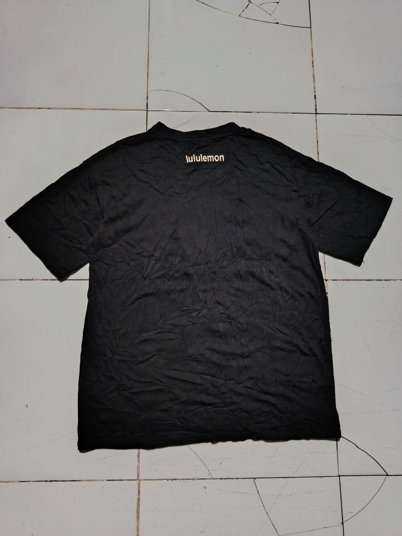 Lululemon Black T-Shirt with Large Logo (Category: Tshirts & Polo Shirts ) located in Barotac Nuevo. Submitted by gray101 (Listing ID 1470681044, Image 2). Description: - Brand: Lululemon - Color: Black with white chest logo graphic - Size: Large - Design: Classic crew neck, short sleeve - Material: Soft cotton blend - Origin: Made in Indonesia (CA35801 / RN106259).