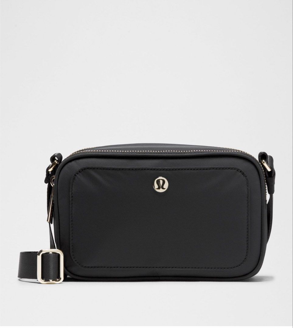 Lululemon Crossbody Camera Bag 2L (Category: Cross-body Bags) located in Muntinlupa City. Submitted by peachonlineshop (Listing ID 1470697831, Image 1). Description: - Brand: Lululemon - Color: Sleek solid black - Compartments: Dual zippered top compartments + exterior back slip pocket - Strap: Adjustable webbing strap with premium metal hardware - Interior: Features official Lululemon logo tag - Fit: Compact and comfortable crossbody ETA pinas i