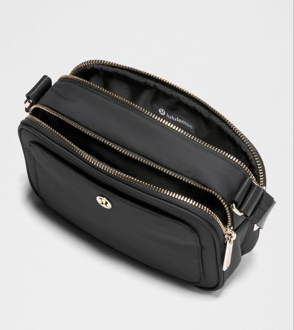 Lululemon Crossbody Camera Bag 2L (Category: Cross-body Bags) located in Muntinlupa City. Submitted by peachonlineshop (Listing ID 1470697831, Image 2). Description: - Brand: Lululemon - Color: Sleek solid black - Compartments: Dual zippered top compartments + exterior back slip pocket - Strap: Adjustable webbing strap with premium metal hardware - Interior: Features official Lululemon logo tag - Fit: Compact and comfortable crossbody ETA pinas i