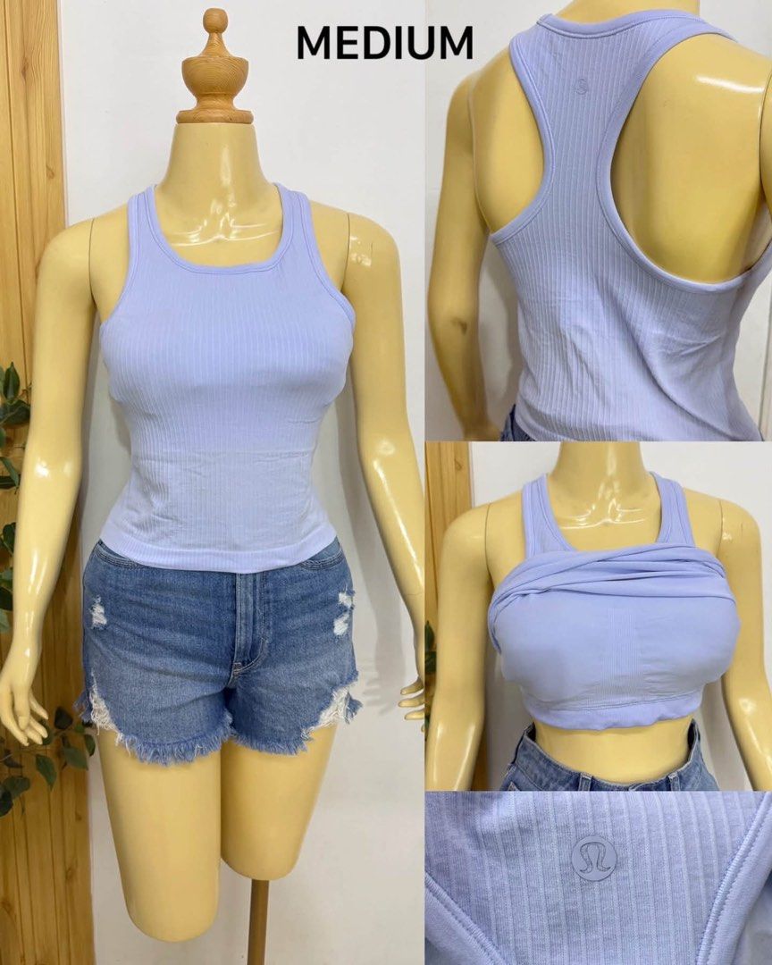Lululemon Ribbed Tank Top Light Purple Medium (Category: Sleeveless) located in Tagum. Submitted by bernardino49694 (Listing ID 1470588317, Image 1). Description: - Brand: Lululemon - Color: Light purple - Size: Medium - Style: Racerback tank top with soft ribbed texture - Support: Built-in shelf bra lining - Details: Iconic printed logo near the bottom hem - Versatility: Perfect for workouts and casual everyday outfitting.