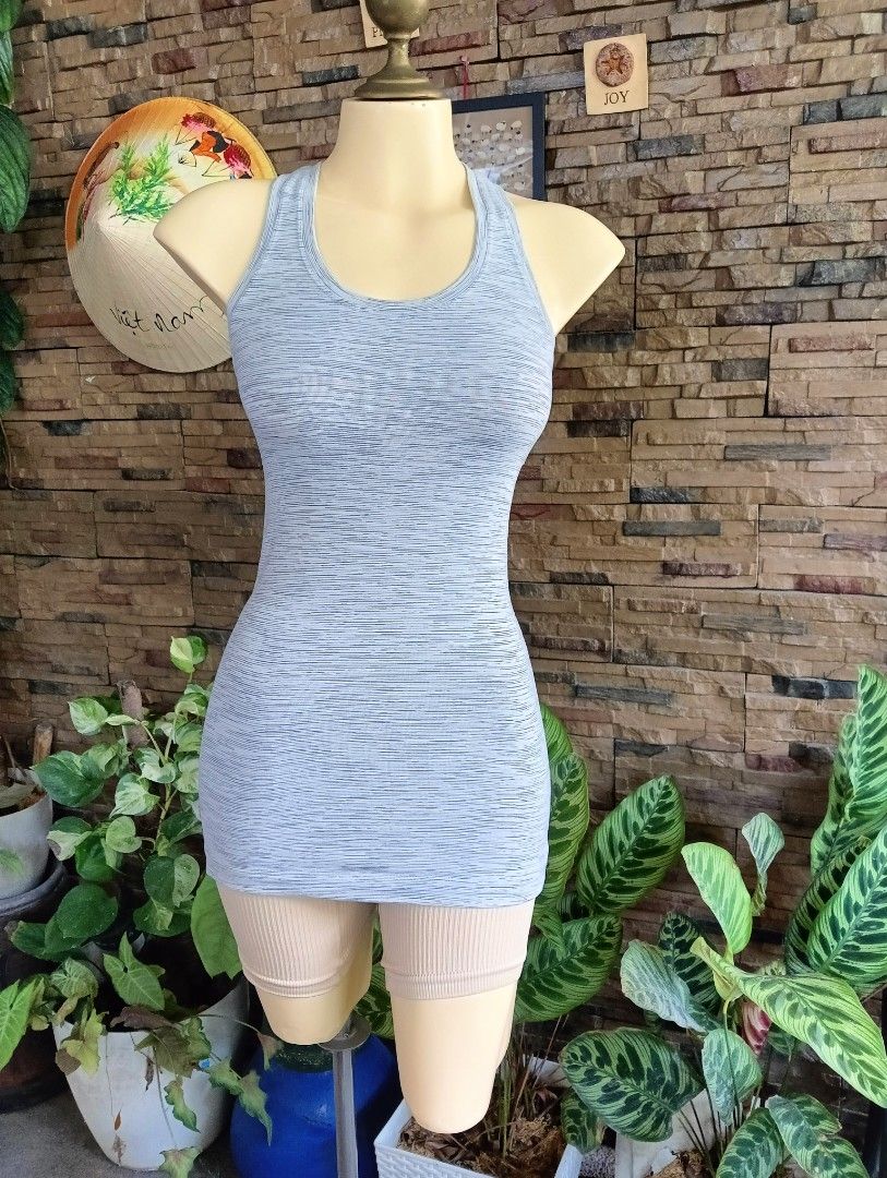 Lululemon Tank Top (Category: Activewear) located in Rizal. Submitted by timeless_shop (Listing ID 1470631875, Image 3). Description: ORIGINAL Lululemon Cool Racerback Tank - Heathered Light Gray -6 📏 Length: 25 inches 📏 Width : 13 inches Bust Fit 32-34 👚 Size: 6 🎨 Color: Heathered Light Gray / White - rare colorway! ✂️ Cut: Racerback - sexy sa likod, free movement 💯 Condition: 9.9/10 🎨 Color Rate: 9.9/10 - Maayos at malinis din 🧵 Quality 