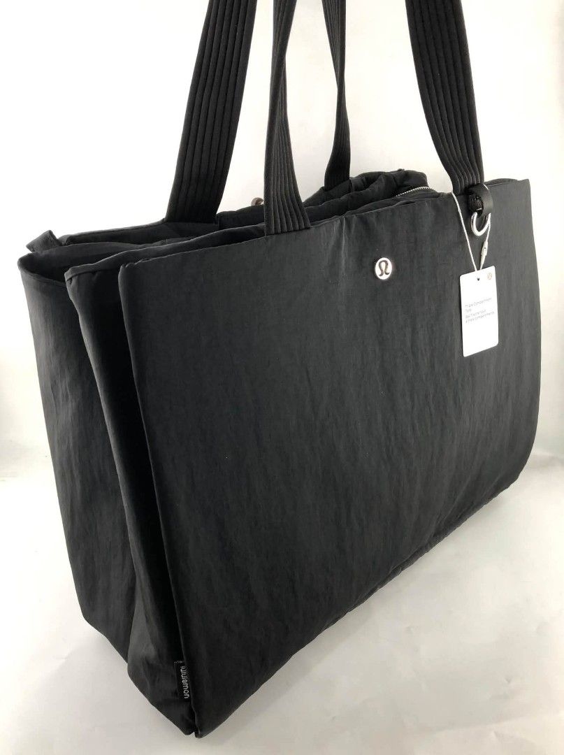 Lululemon Triple Compartment Tote Bag 18L (Category: Tote Bags) located in Manila. Submitted by msddirectfactoryoutlet (Listing ID 1470594945, Image 2). Description: Triple Compartment Tote Bag Dimensions: W 42cm x D 15cm x H 30cm (16.5" x 5.9" x 11.8") Volume: 18L.