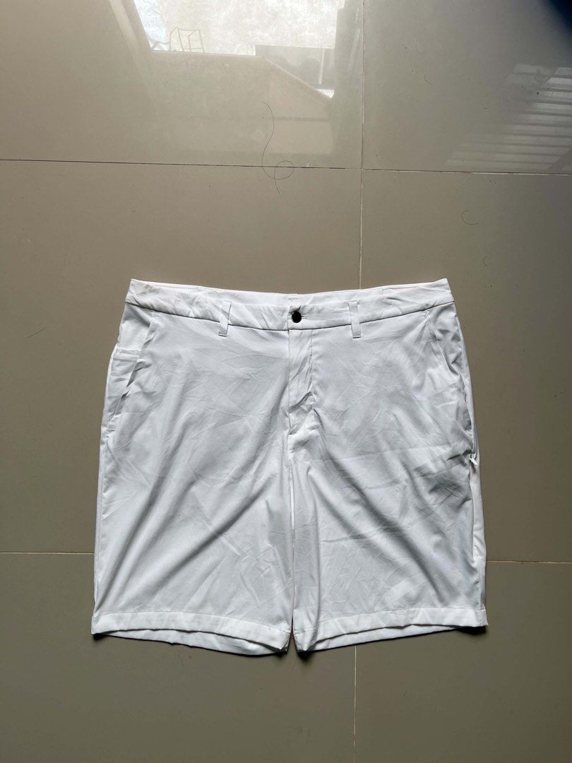 Lululemon White Men Shorts Size 38 (Category: Shorts) located in Lapu Lapu. Submitted by trip-thrift (Listing ID 1470643309, Image 1). Description: - Brand: Lululemon - Size: 38 - Material: 95% Nylon, 5% Elastane - Closure: Standard button closure with belt loops - Pockets: Convenient front and rear pockets - Style: Classic casual design, highly versatile for everyday wear.