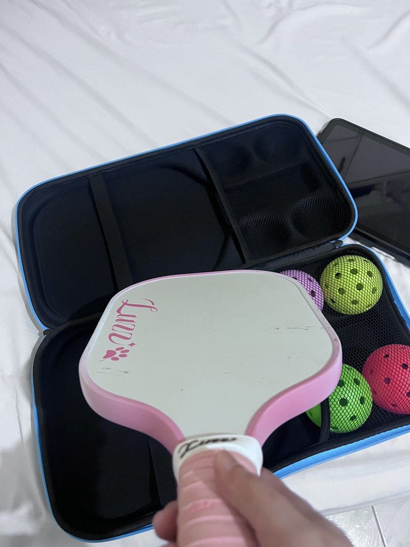 Luzz Pickleball Paddle Set with Case and Balls (Category: Racket and Ball Sports) located in Cotabato. Submitted by goodbyethings09 (Listing ID 1470703717, Image 2). Description: - Adorable Luzz pickleball paddle with cute cat face graphics - Comfortable pink grip tape wrapped handle - USA Pickleball approved for official play - Includes matching carrying case and 4 pickleballs (green, pink, and purple) - Condition: Minor dirt marks on the white 