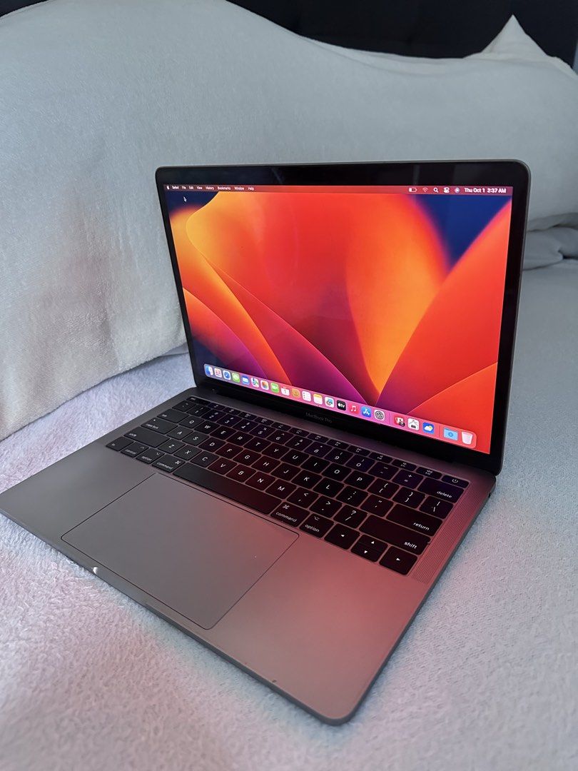 MacBook Pro 13-inch 2017 Space Grey (Category: Laptops & Notebooks) located in Naga. Submitted by marwingarol (Listing ID 1470582285, Image 2). Description: - Model: Apple Laptop in Space Grey with black keyboard - OS: macOS Ventura - Performance: Intel Core i5 processor with 8GB memory - Graphics: Intel Iris Plus Graphics - Ports: Two Thunderbolt 3 ports - Condition: Clean overall appearance, bright screen, and fully operational keyboard and tra