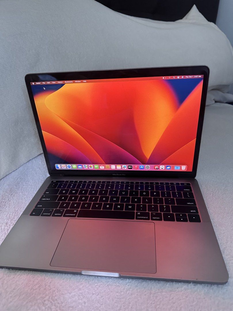 MacBook Pro 13-inch 2017 Space Grey (Category: Laptops & Notebooks) located in Naga. Submitted by marwingarol (Listing ID 1470582285, Image 3). Description: - Model: Apple Laptop in Space Grey with black keyboard - OS: macOS Ventura - Performance: Intel Core i5 processor with 8GB memory - Graphics: Intel Iris Plus Graphics - Ports: Two Thunderbolt 3 ports - Condition: Clean overall appearance, bright screen, and fully operational keyboard and tra