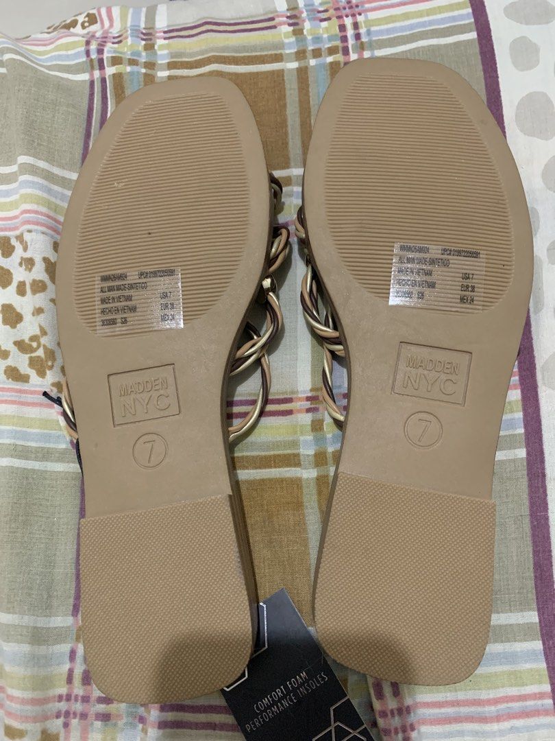 Madden NYC Stud Slide Sandals Brown Size 7 (Category: Flats & Sandals) located in Bugallon. Submitted by lavenderlane (Listing ID 1470681252, Image 3). Description: - Brand: Madden NYC - Item: Stud slide sandals - Color: Brown and metallic gold with gold-colored sphere accents - Size: US 7, EUR 38, MEX 24 - Design: Stylish braided strap - Comfort: Comfort foam performance insoles with odor-reducing technology - Condition: Brand new with original 