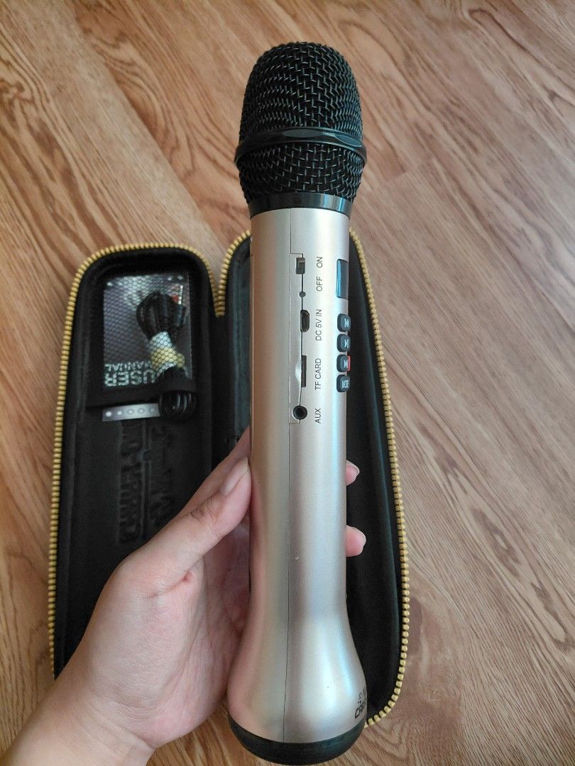 Magic Carry-Oke+ Wireless Karaoke Microphone (Category: Microphones) located in Quezon City. Submitted by prelovedbythea19 (Listing ID 1470633693, Image 3). Description: - Product: Magic Carry-Oke+ Wireless Microphone - Color: Elegant Gold - Controls: Built-in front buttons for volume, echo, and mic settings - Ports: AUX, TF card, DC 5V charging, and power switch - Inclusions: Protective zippered carry case, user manual, and audio cable - Perfect