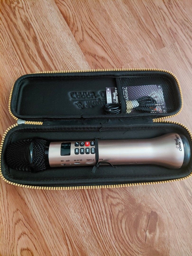 Magic Carry-Oke+ Wireless Karaoke Microphone (Category: Microphones) located in Quezon City. Submitted by prelovedbythea19 (Listing ID 1470633693, Image 1). Description: - Product: Magic Carry-Oke+ Wireless Microphone - Color: Elegant Gold - Controls: Built-in front buttons for volume, echo, and mic settings - Ports: AUX, TF card, DC 5V charging, and power switch - Inclusions: Protective zippered carry case, user manual, and audio cable - Perfect