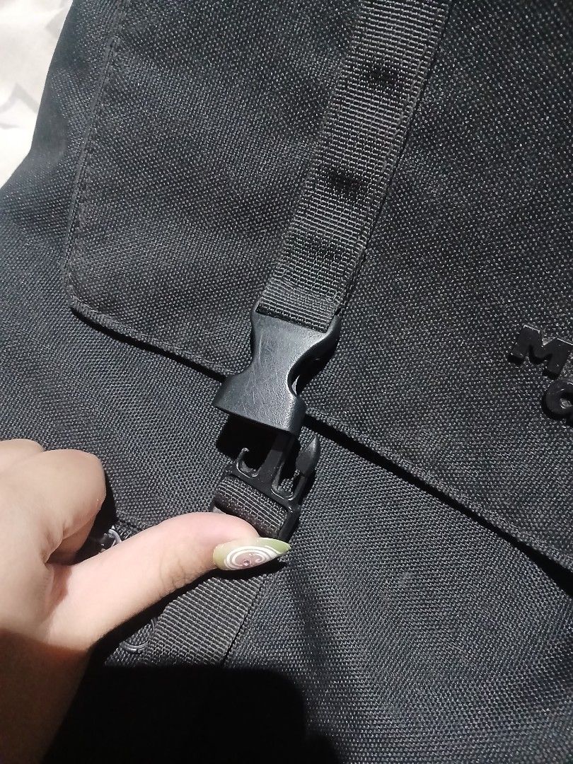 maH siro bag, the broken part can be replaced. (Category: Backpacks) located in Manila. Submitted by iiselou (Listing ID 1470674571, Image 2). Description: - Color: Sleek black - Material: Durable, sturdy canvas suitable for daily use - Design: Minimalist style with subtle embossed branding - Storage: Main zippered compartment plus extra zippered pockets - Closure: Dual front straps with secure plastic side-release buckles - Best for: School, wor