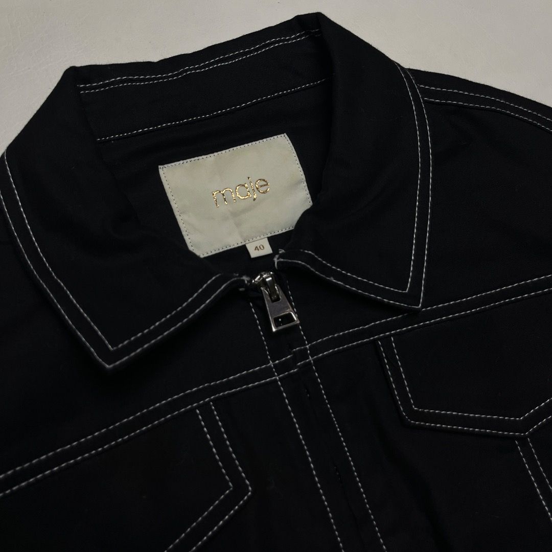 Maje Black Cropped Bomber Jacket Size 40 (Category: Coats, Jackets and Outerwear) located in Caloocan City. Submitted by achilles_grails (Listing ID 1470583198, Image 2). Description: - Brand: Maje - Color: Black with contrast white stitching - Size: 40 (Tag inside collar) - Model Code: E19BOMBI BLACK - Features: Full zip front, classic collar, dual chest flap pockets, ribbed hem and cuffs - Material: Clean cotton blend.