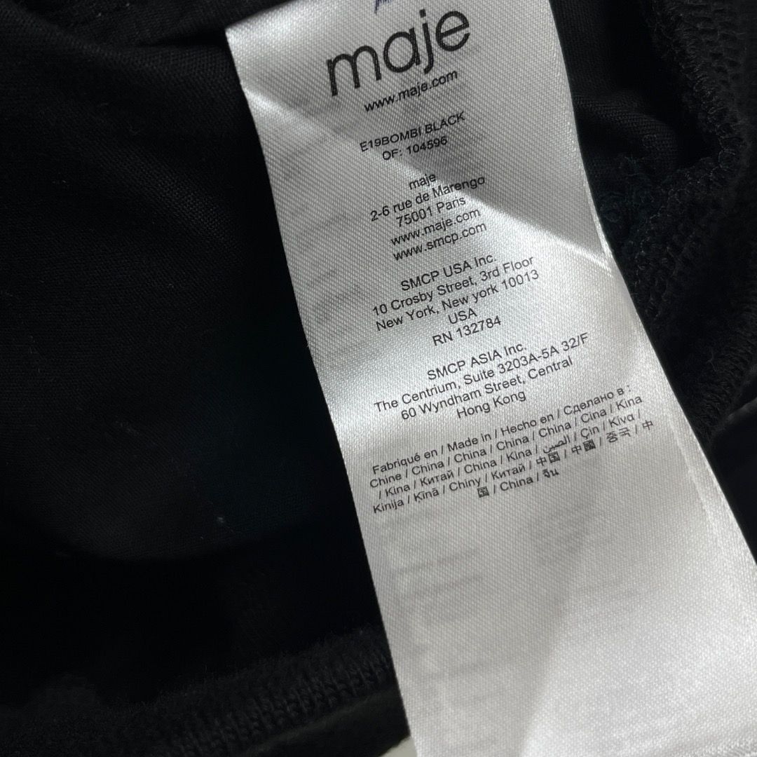 Maje Black Cropped Bomber Jacket Size 40 (Category: Coats, Jackets and Outerwear) located in Caloocan City. Submitted by achilles_grails (Listing ID 1470583198, Image 3). Description: - Brand: Maje - Color: Black with contrast white stitching - Size: 40 (Tag inside collar) - Model Code: E19BOMBI BLACK - Features: Full zip front, classic collar, dual chest flap pockets, ribbed hem and cuffs - Material: Clean cotton blend.