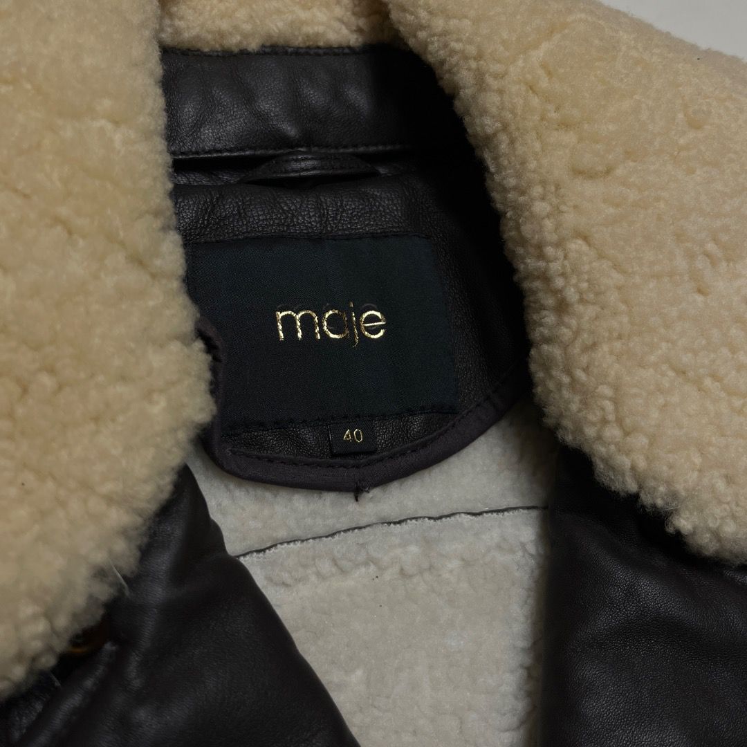 Maje Lambskin Leather Shearling Biker Jacket (Category: Coats, Jackets and Outerwear) located in Caloocan City. Submitted by achilles_grails (Listing ID 1470676055, Image 2). Description: - Brand: Maje - Style: Lambskin Leather Shearling Biker Jacket - Size: 40 - Color: Black with cream shearling - Material: Genuine lambskin leather outer with plush shearling collar and lining - Features: Asymmetric front zipper, zippered pockets, and adjustable 