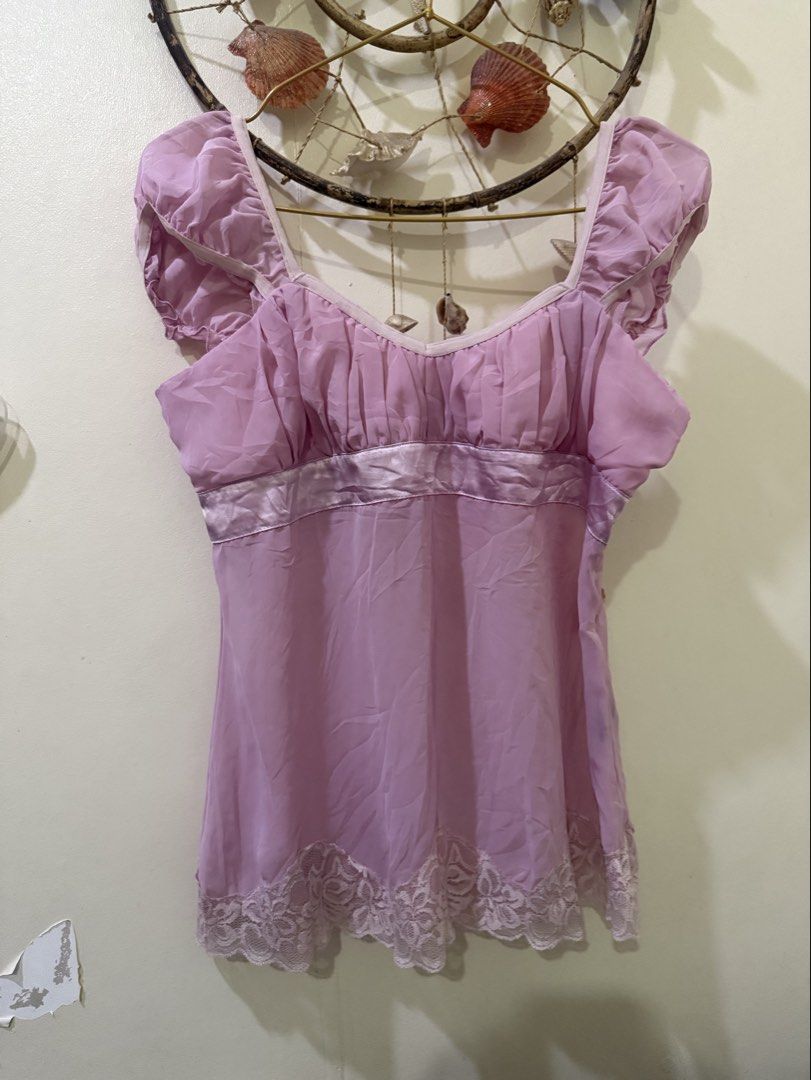 Majora Lavender Chiffon Ruffle Cap Sleeve Blouse Top M (Category: Blouses) located in Cebu City. Submitted by hotchkisscebu (Listing ID 1470636113, Image 1). Description: - Brand/Model: Majora Lavender Blouse - Size: Medium (M) - Material: Lightweight chiffon - Design: Square neckline (front and back), gathered bust, and satin waist band - Details: Cute ruffle cap sleeves and pretty floral lace trim along the bottom hem - Origin: Made in China.