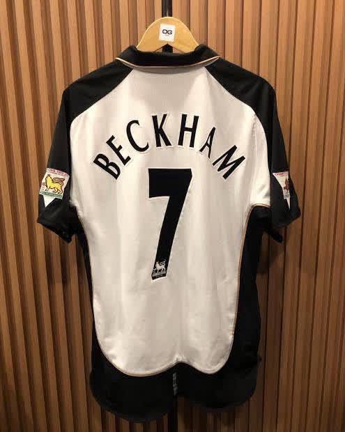 Manchester United Beckham 7 Jersey (100th anniversary) (Category: Activewear) located in Manila. Submitted by ianxr (Listing ID 1470677521, Image 2). Description: - Authentic Manchester United away jersey - Vodafone era vintage classic - David Beckham #7 printing on the back - Iconic Umbro design with stylish black and white panels - Features embroidered club crest and sponsor logos - Short sleeves with a classic polo collar - Perfect for fans an
