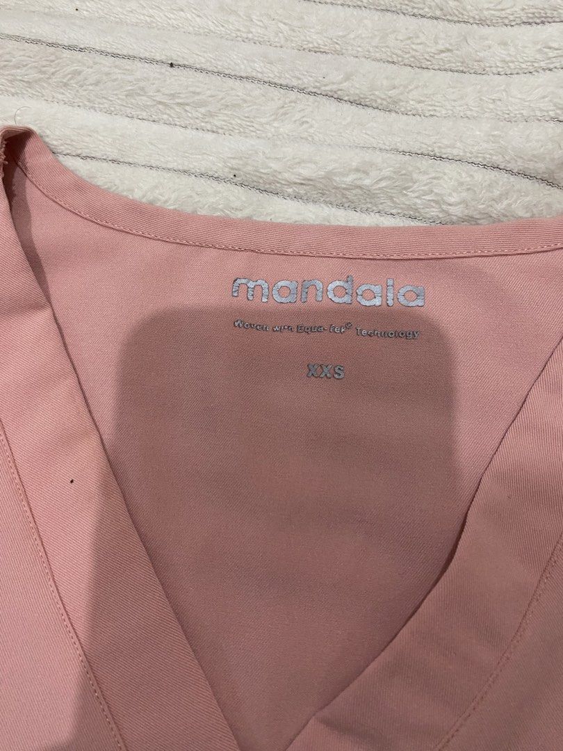 Mandala scrub top (Category: Activewear) located in Tanza. Submitted by 9th.street.thrift (Listing ID 1470594954, Image 3). Description: Mandala scrub top Good as new No issue Same as figs tela Color baby pink Xxs on tag 18x24.5 .
