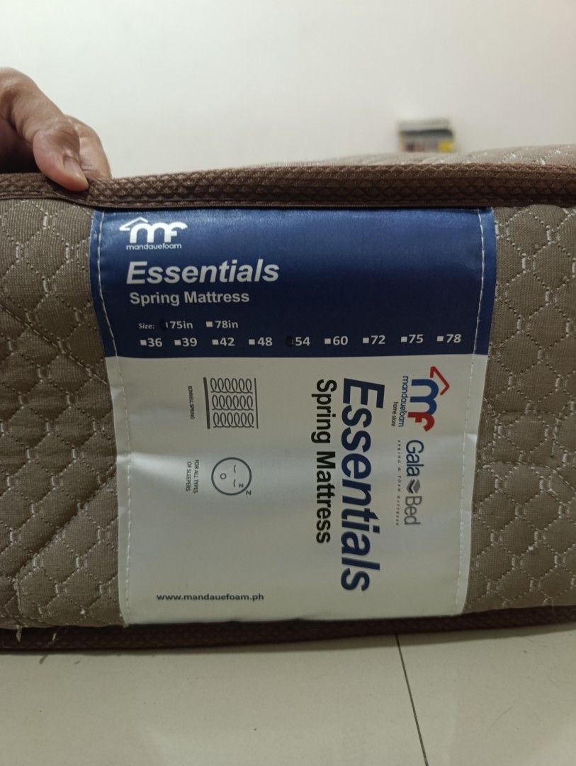 Mandaue Foam Gala Essential Spring Double Mattress 54x75 (Category: Bed Frames & Mattresses) located in Manila. Submitted by gats17 (Listing ID 1470679010, Image 1). Description: Mandaue Foam Gala Essential spring mattress in Darby Brown. - Double size measuring 54 x 75 inches. - Used condition (1.5 yr) with visible cat scratches on the surface and edges as pictured. - Original tag intact on the side..