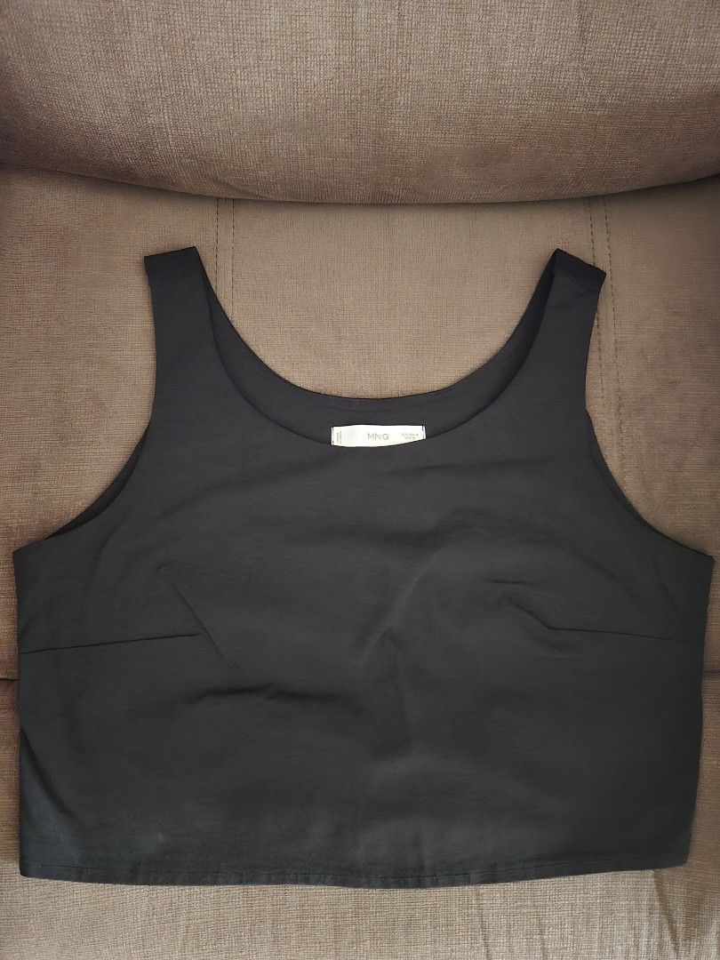 Mango Black Crop Top Size M (Category: Sleeveless) located in Quezon City. Submitted by mgdeclutters (Listing ID 1470653629, Image 1). Description: - Brand: Mango - Item: Black crop top - Size: Medium (Tag reads EUR S, USA M, MEX 28) - Design: Classic scoop neckline, thick shoulder straps, and sleeveless - Styling: Easy to match with high-waisted jeans or skirts.