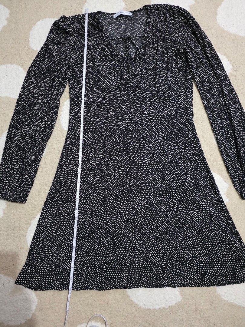 Mango Black White Polka Dot Mini Dress (Category: Dresses) located in Marikina City. Submitted by dclicious2.0 (Listing ID 1470662966, Image 3). Description: known as the Mango Pomelo Printed Bow Dress (also listed on retail platforms as the Mango Tie Front Spot Print Midi Dress), key details of this design include: • Style: A-line midi/maxi column dress crafted from a lightweight, fluid fabric. • Features: Deep V-neckline with delicate criss-cro