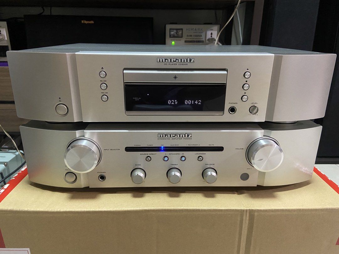 Marantz PM5004 Integrated Amplifier and CD5005 CD Player Stack (Category: Soundbars, Speakers & Amplifiers) located in Pasig City. Submitted by reactxs (Listing ID 1470614543, Image 1). Description: - Model: Marantz PM5004 Integrated Amplifier and CD5005 CD Player - Finish: Elegant silver with dual knobs and front displays - Origin: Japanese market 100V / 110V models - Condition: Clean and 100% fully functional - Features: Multiple rear inputs/ou