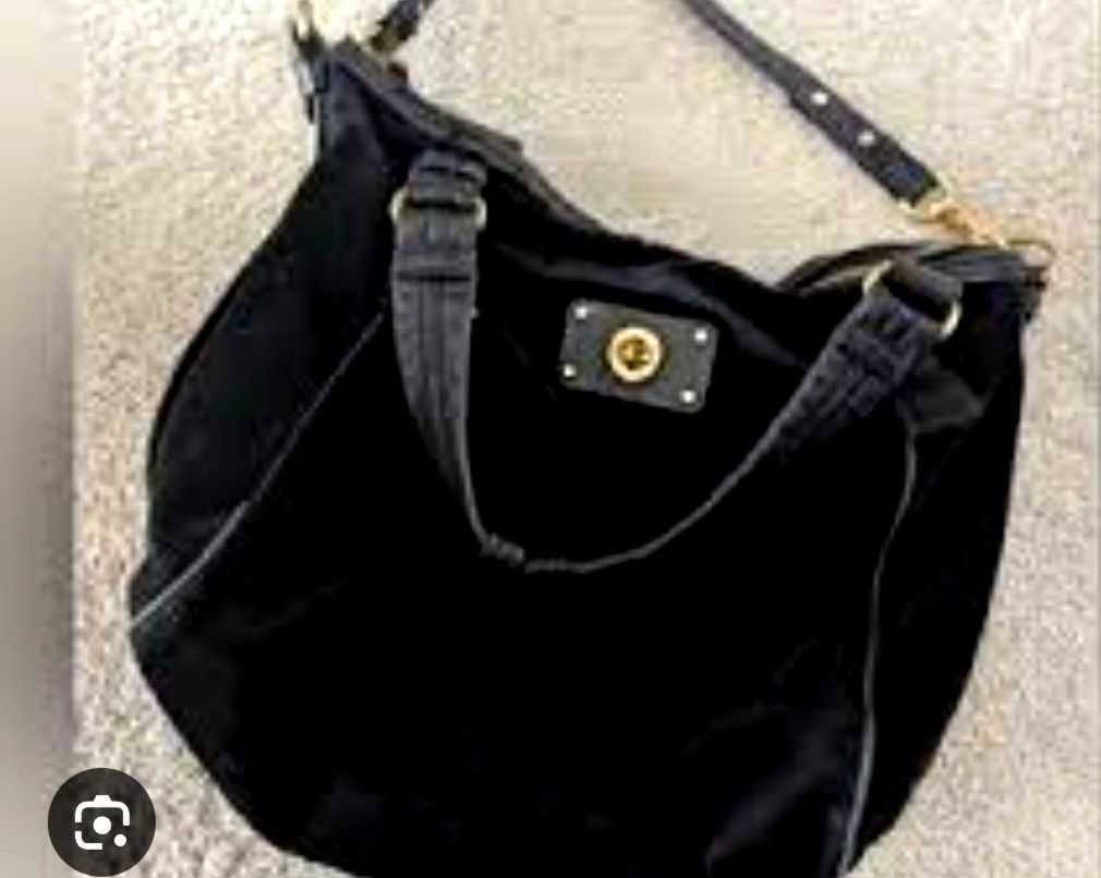 Marc by Marc Jacobs Black Suede Handbag (Category: Cross-body Bags) located in Manila. Submitted by lene48 (Listing ID 1470669654, Image 1). Description: - Authentic Marc by Marc Jacobs shoulder bag - Luxurious black suede with gold-tone hardware - Front pocket with secure engraved turn-lock closure - Versatile carry: dual top handles + detachable, adjustable strap - Spacious fabric-lined interior for everyday essentials - Includes original dust 