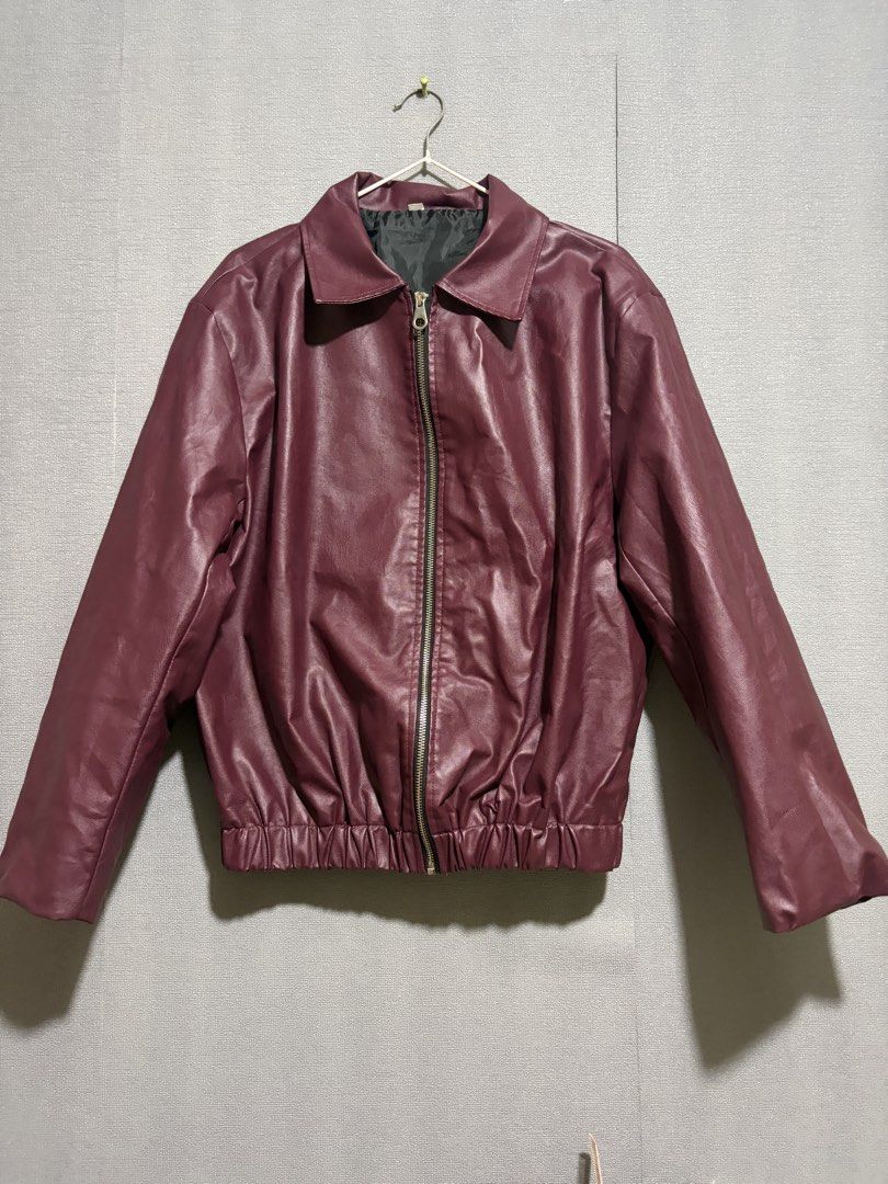 Maroon Faux Leather Bomber Jacket (Category: Coats, Jackets and Outerwear) located in Manila. Submitted by wildriver.e8b64e (Listing ID 1470707511, Image 3). Description: Fit upto large - Color: Maroon - Material: Faux leather with black inner lining - Closure: Full front zipper with collar - Fit: Elasticized waistband and cuffs - Condition: Clean finish, ready to wear.