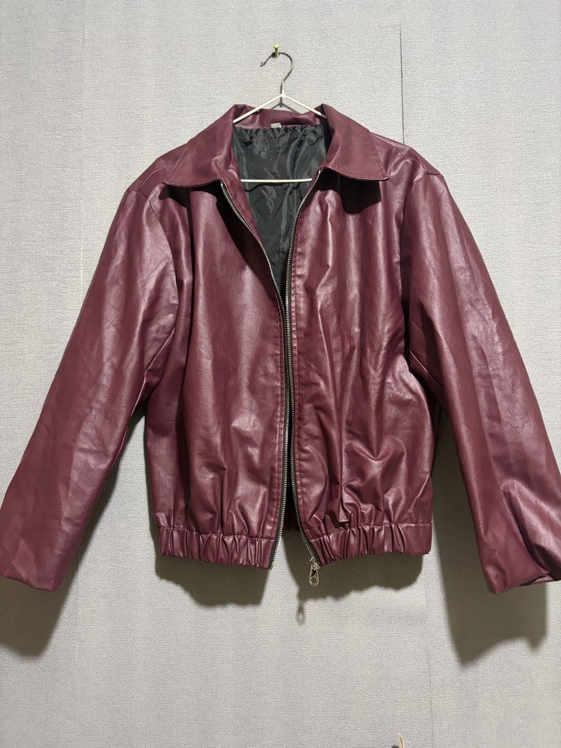 Maroon Faux Leather Bomber Jacket (Category: Coats, Jackets and Outerwear) located in Manila. Submitted by wildriver.e8b64e (Listing ID 1470707511, Image 1). Description: Fit upto large - Color: Maroon - Material: Faux leather with black inner lining - Closure: Full front zipper with collar - Fit: Elasticized waistband and cuffs - Condition: Clean finish, ready to wear.