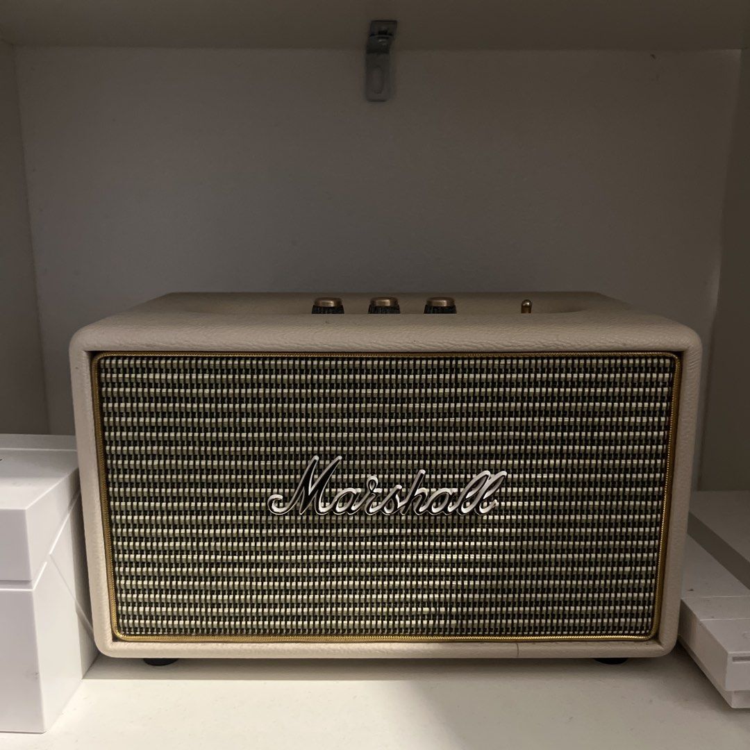 Marshall Acton 2 Bluetooth Speaker Cream (Category: Soundbars, Speakers & Amplifiers) located in Manila. Submitted by icyvntgfinds (Listing ID 1470638534, Image 1). Description: - Model: Marshall Acton Bluetooth Speaker - Design: Cream leather-style finish with classic vintage look and brass control knobs - Controls: Dedicated knobs for volume, bass, and treble, plus a physical power toggle switch - Connectivity: Bluetooth and auxiliary input por
