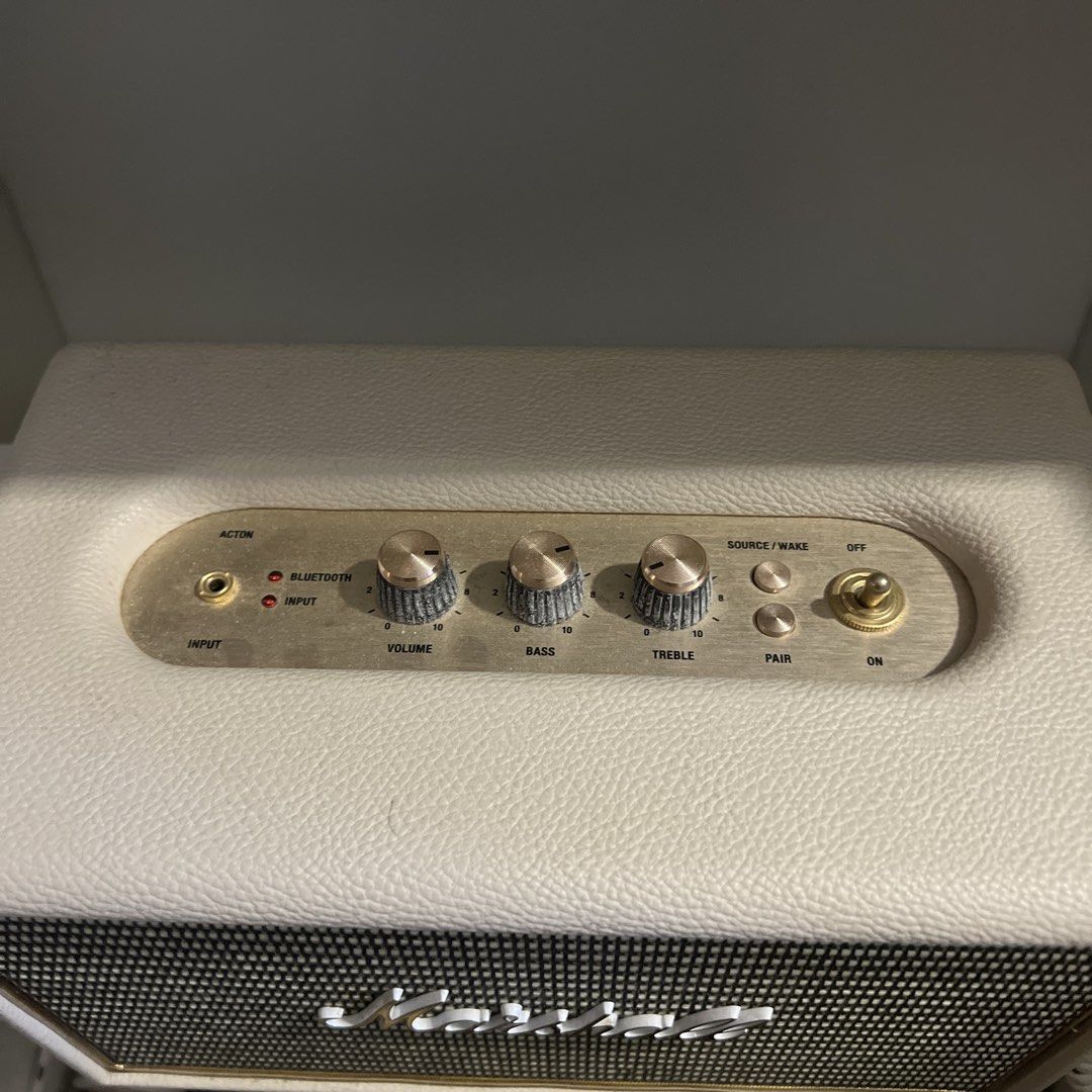 Marshall Acton 2 Bluetooth Speaker Cream (Category: Soundbars, Speakers & Amplifiers) located in Manila. Submitted by icyvntgfinds (Listing ID 1470638534, Image 2). Description: - Model: Marshall Acton Bluetooth Speaker - Design: Cream leather-style finish with classic vintage look and brass control knobs - Controls: Dedicated knobs for volume, bass, and treble, plus a physical power toggle switch - Connectivity: Bluetooth and auxiliary input por