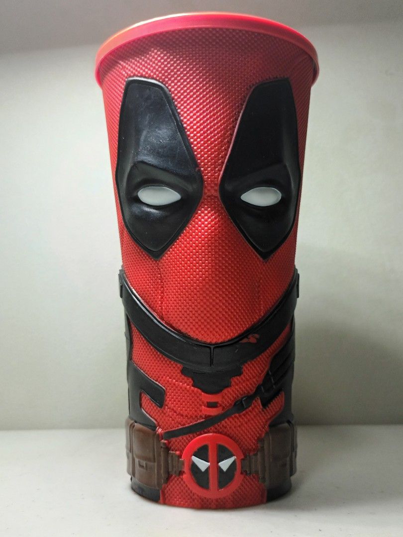 Marvel Deadpool Popcorn Bucket (Category: Western Merchandise) located in Daet. Submitted by .wenz (Listing ID 1470590536, Image 1). Description: - Authentic Deadpool movie popcorn bucket - Iconic red and black textured suit design with molded eyes and belt buckle detail - Standard cinema cup size - Clean interior, excellent for display or collection - Must-have for Marvel fans.