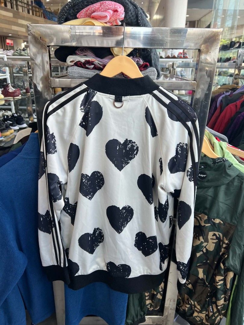 Mastermind Japan White Black Heart Bomber Jacket XL (Category: Coats, Jackets and Outerwear) located in Urdaneta. Submitted by jayceegarage (Listing ID 1470691754, Image 2). Description: - Brand: Mastermind Japan - Style: Zip-up bomber jacket - Color/Design: White base with all-over distressed black heart pattern - Details: Embroidered skull and crossbones logo on chest, functional side pockets - Trim: Ribbed black collar, cuffs, and hem - Materi