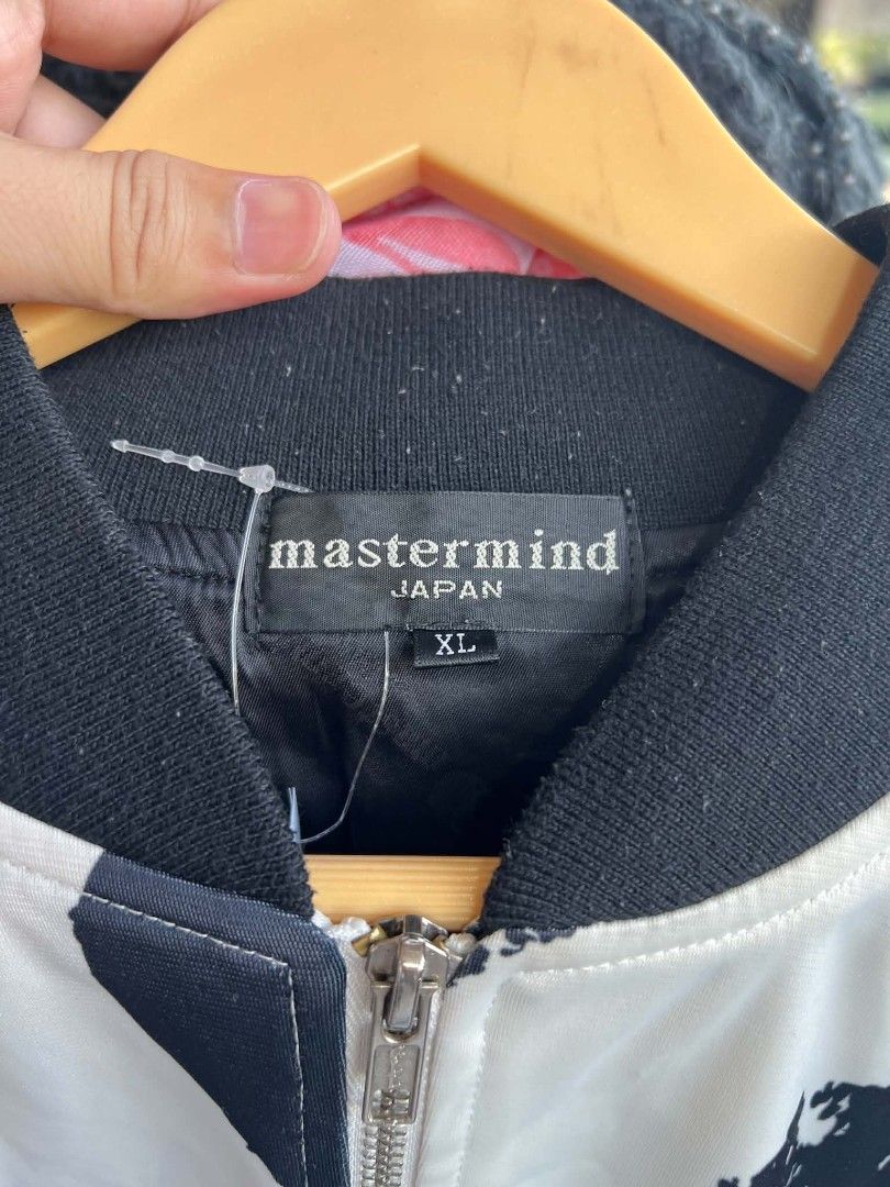 Mastermind Japan White Black Heart Bomber Jacket XL (Category: Coats, Jackets and Outerwear) located in Urdaneta. Submitted by jayceegarage (Listing ID 1470691754, Image 3). Description: - Brand: Mastermind Japan - Style: Zip-up bomber jacket - Color/Design: White base with all-over distressed black heart pattern - Details: Embroidered skull and crossbones logo on chest, functional side pockets - Trim: Ribbed black collar, cuffs, and hem - Materi