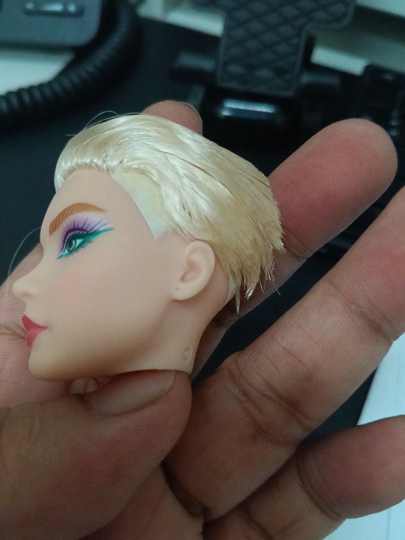 Mattel Barbie Andra Mold Head (Category: Kids Toys) located in Manila. Submitted by keengem-3585 (Listing ID 1470560675, Image 3). Description: - Authentic 2021 Mattel Barbie Extra doll head - Stylish blonde hair with trendy flocked undercut sides - Detailed purple and green eye makeup with pink lips - Standard neck hole compatible with most pop-off bodies - Ideal for custom doll projects and OOAK creations.
