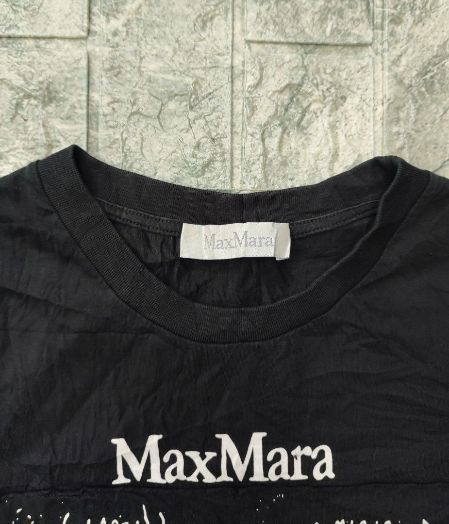 Max Mara Colibri Printed Shirt (Category: Shirts) located in Bayambang. Submitted by mon10192816 (Listing ID 1470647793, Image 2). Description: - Width - 18 - Length - 25.5 - Brand: MaxMara - Color: Black - Style: Short-sleeve t-shirt with round ribbed neckline - Design: Math formulas graphic print on front with MM 1951 logo patch - Size: Refer to internal tag.