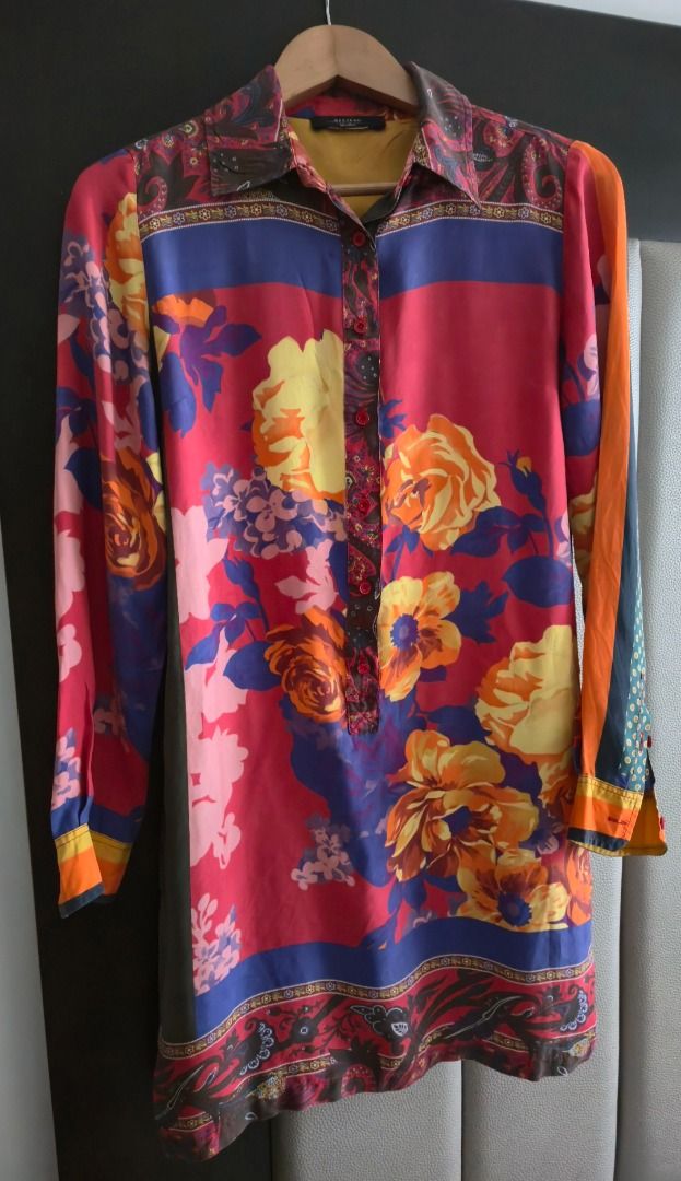 Max Mara Weekend Silk Printed Tunic Dress (Category: Dresses) located in Taguig. Submitted by romain.miu.11 (Listing ID 1470643886, Image 2). Description: Max Mara Weekend red and multicolour 100% silk mini tunic dress featuring a spread collar, half button up front closure, in seam pockets, buttoned cuffs, and mixed floral, ornate, and polka dot print throughout..