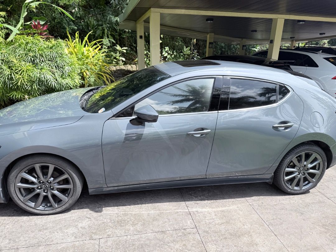 Mazda 3 Hatchback 2020 Premium Auto (Category: Used Cars) located in Manila. Submitted by juliancohen (Listing ID 1470580368, Image 3). Description: 57,000 KM Original owner Regulaly serviced by Mazda Pampanga Nothing to fix. Close to 100% cosmetically. No wheel scapes. Only thing needed is for the front tint to be replaced as it is peeling. Top of the line model with sunroof, 360 camera, radar cruise control, autonomous braking forward and rever
