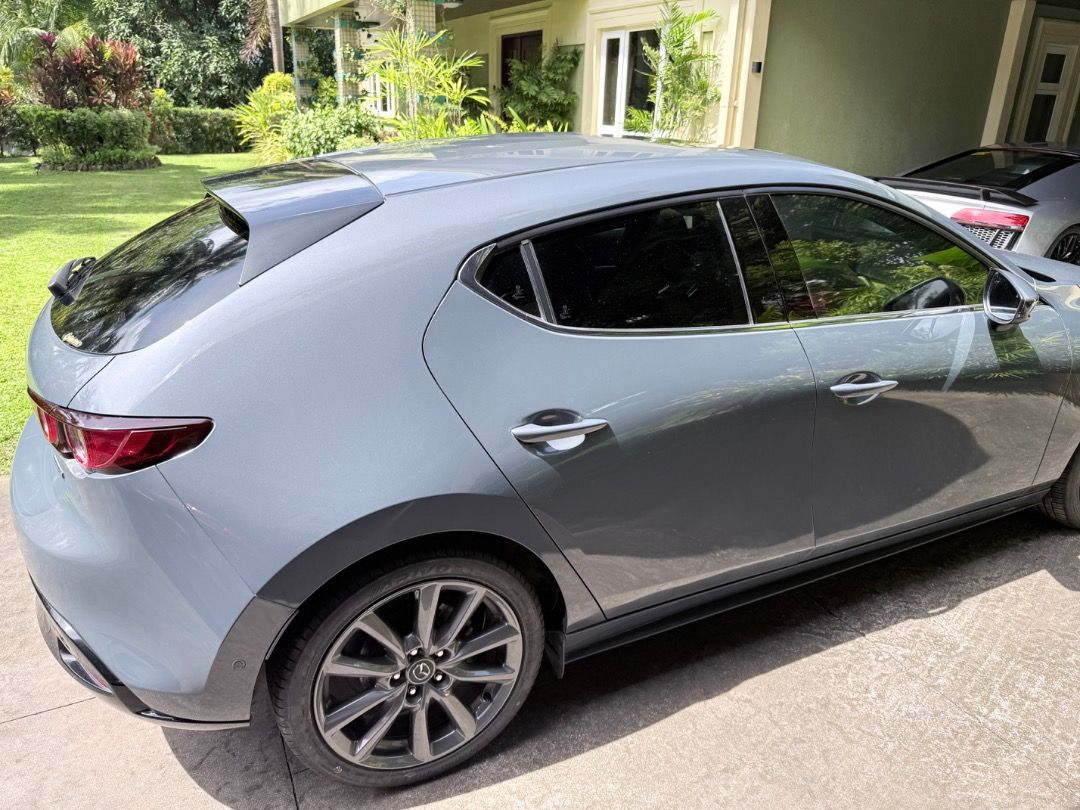 Mazda 3 Hatchback 2020 Premium Auto (Category: Used Cars) located in Manila. Submitted by juliancohen (Listing ID 1470580368, Image 2). Description: 57,000 KM Original owner Regulaly serviced by Mazda Pampanga Nothing to fix. Close to 100% cosmetically. No wheel scapes. Only thing needed is for the front tint to be replaced as it is peeling. Top of the line model with sunroof, 360 camera, radar cruise control, autonomous braking forward and rever