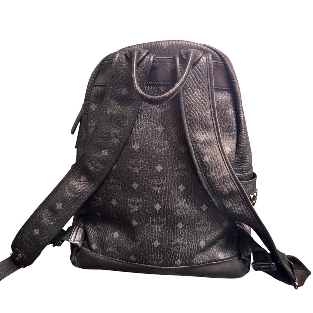 MCM Backpack Medium (Category: Backpacks) located in Baguio. Submitted by pwz-eshop (Listing ID 1470638297, Image 2). Description: • Up for Grabs!! • Guaranteed Authentic!! • Flaws: Rubs and scuffs on base leather part, leather handle and leather part of strap connector, scuffs on interior but still functional (not flaky). Stiff zipper (hard to pull but move with effort. (please see photos) • BRAND: MCM. • DIMENSIONS: length 14", height 15", widt