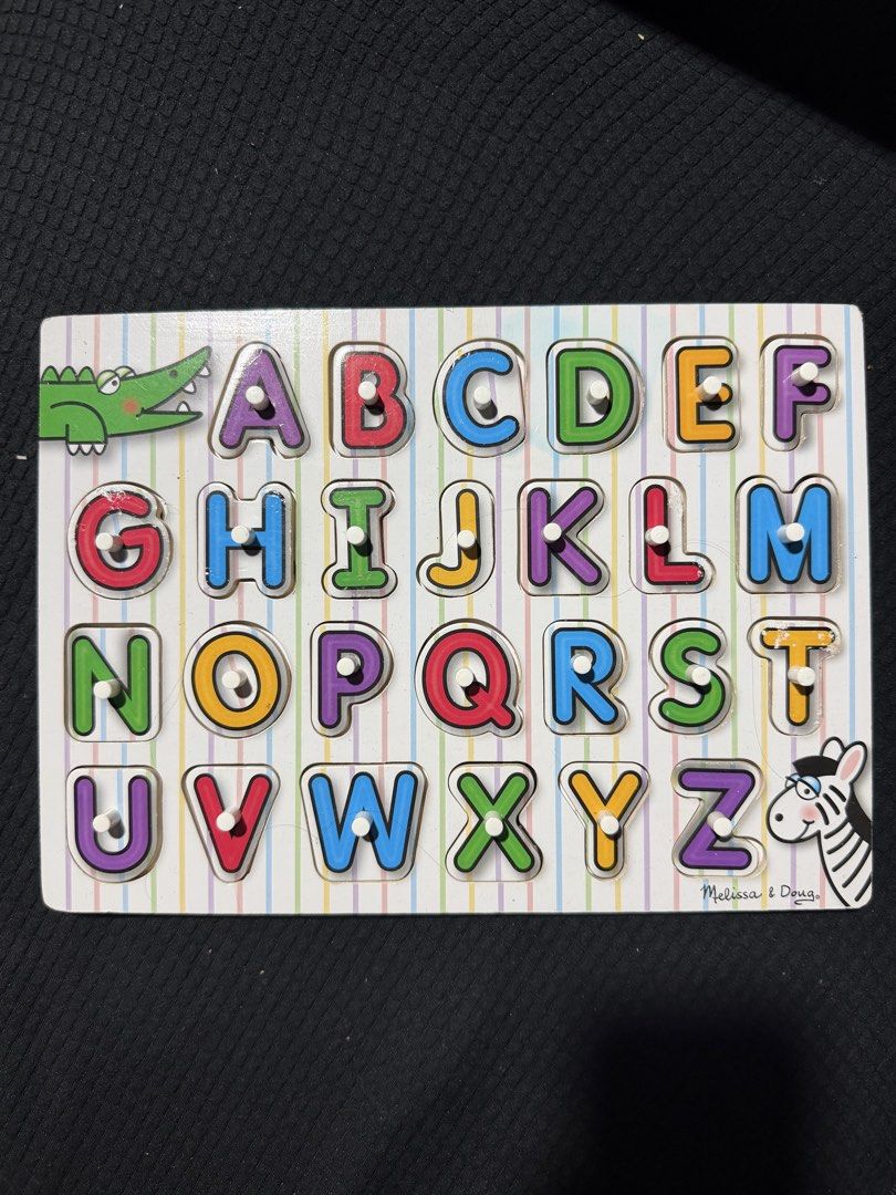 Melissa & Doug Wooden Alphabet Form Board (Category: Educational & Learning Toys) located in Quezon City. Submitted by celinecabrera (Listing ID 1470720184, Image 1). Description: - Authentic Melissa & Doug alphabet form board - Complete set with all 26 chunky wooden letters and pegs - Minor wear and peeling on a few letter edges (specifically T, L, and G) - Excellent educational toy for practicing ABCs and fine motor skills - Ideal for toddlers 