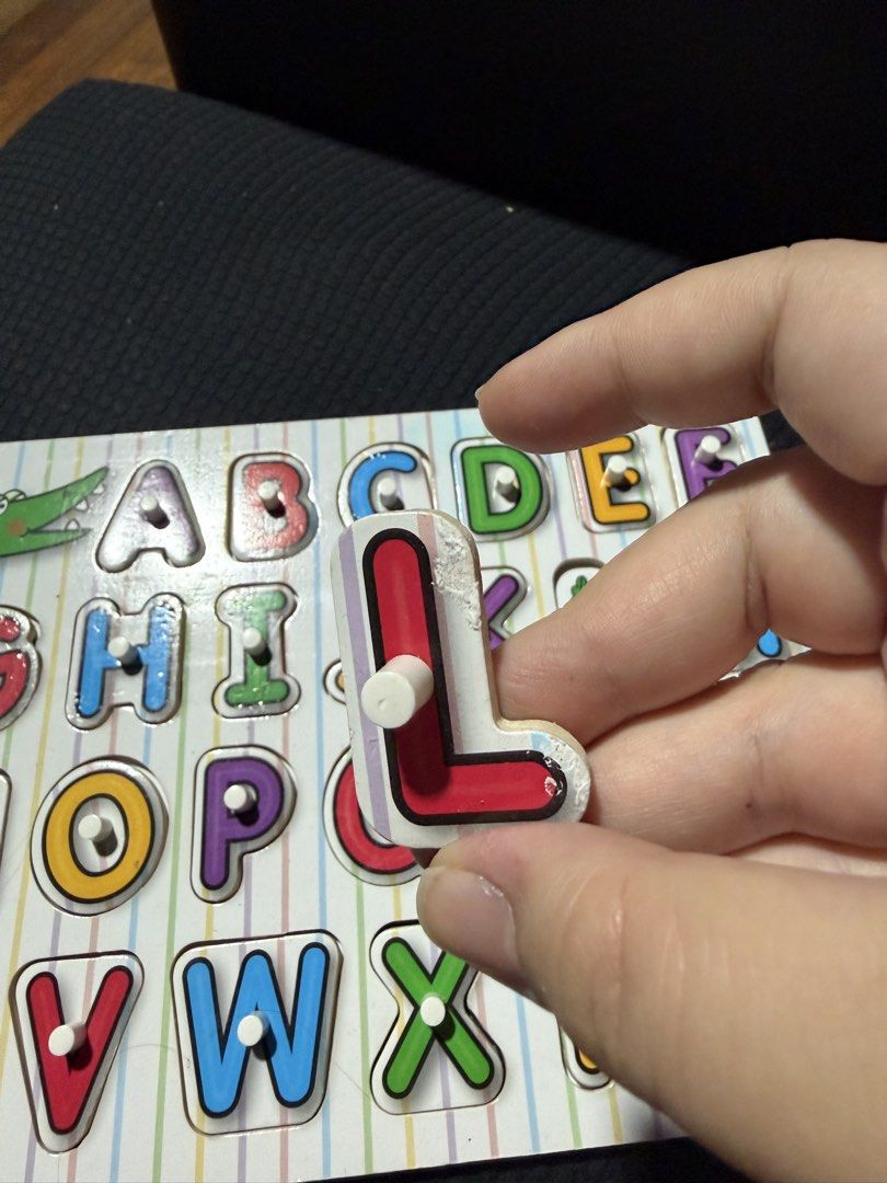 Melissa & Doug Wooden Alphabet Form Board (Category: Educational & Learning Toys) located in Quezon City. Submitted by celinecabrera (Listing ID 1470720184, Image 3). Description: - Authentic Melissa & Doug alphabet form board - Complete set with all 26 chunky wooden letters and pegs - Minor wear and peeling on a few letter edges (specifically T, L, and G) - Excellent educational toy for practicing ABCs and fine motor skills - Ideal for toddlers 
