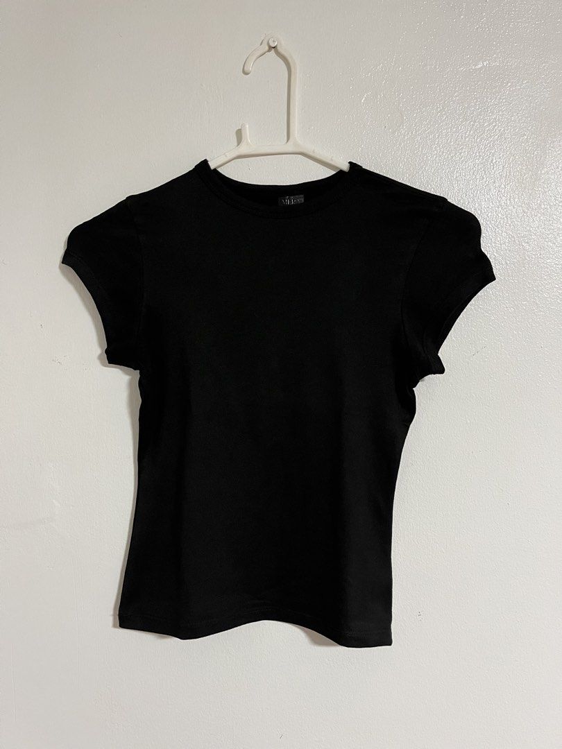 Mera Black Fitted Crew Neck Short Sleeve Top (Category: Shirts) located in Cabuyao City. Submitted by rdtrmt (Listing ID 1470743106, Image 1). Description: - Brand: Mera - Color: Solid black - Style: Basic short sleeve top with round crew neckline - Fit: Fitted cut - Versatility: Easy to pair with jeans or skirts - Condition: Clean fabric, still in good condition.