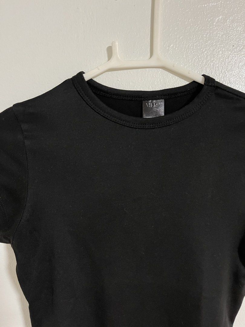 Mera Black Fitted Crew Neck Short Sleeve Top (Category: Shirts) located in Cabuyao City. Submitted by rdtrmt (Listing ID 1470743106, Image 2). Description: - Brand: Mera - Color: Solid black - Style: Basic short sleeve top with round crew neckline - Fit: Fitted cut - Versatility: Easy to pair with jeans or skirts - Condition: Clean fabric, still in good condition.