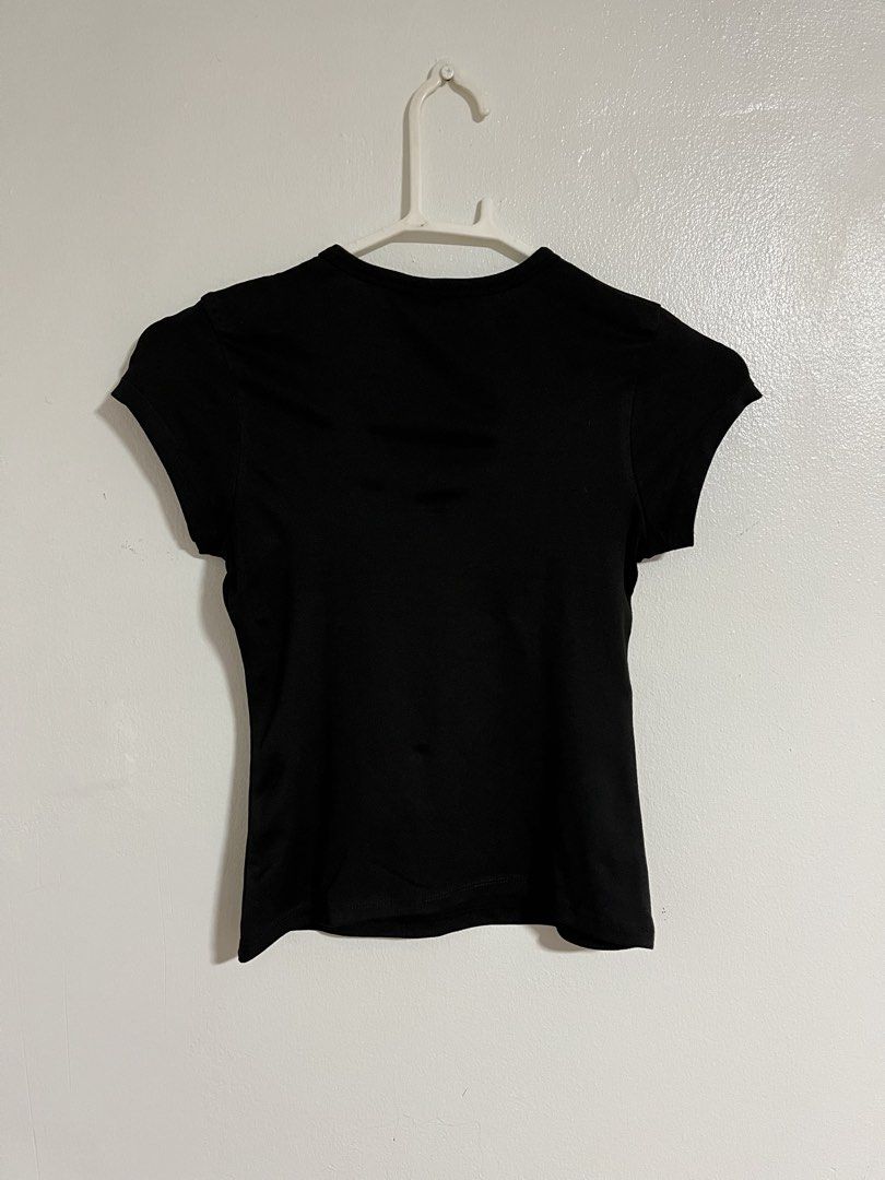 Mera Black Fitted Crew Neck Short Sleeve Top (Category: Shirts) located in Cabuyao City. Submitted by rdtrmt (Listing ID 1470743106, Image 3). Description: - Brand: Mera - Color: Solid black - Style: Basic short sleeve top with round crew neckline - Fit: Fitted cut - Versatility: Easy to pair with jeans or skirts - Condition: Clean fabric, still in good condition.