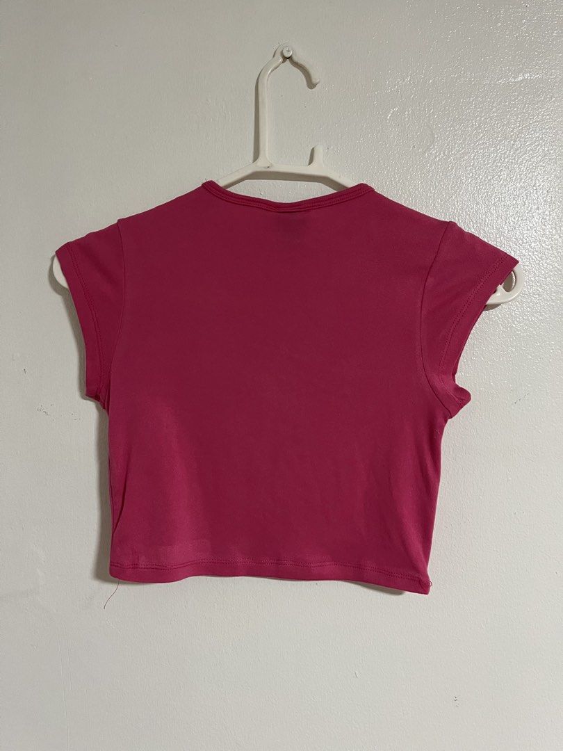 MERA Pink Crop Top (Category: Shirts) located in Cabuyao City. Submitted by rdtrmt (Listing ID 1470743288, Image 3). Description: - Brand: MERA - Size: Small (tag at inner collar) - Color: Bright pink / solid - Style: Short sleeves, crew neckline, plain back crop top - Pairing tip: Easy to match with high-waisted jeans or skirts - Condition: still in good condition.