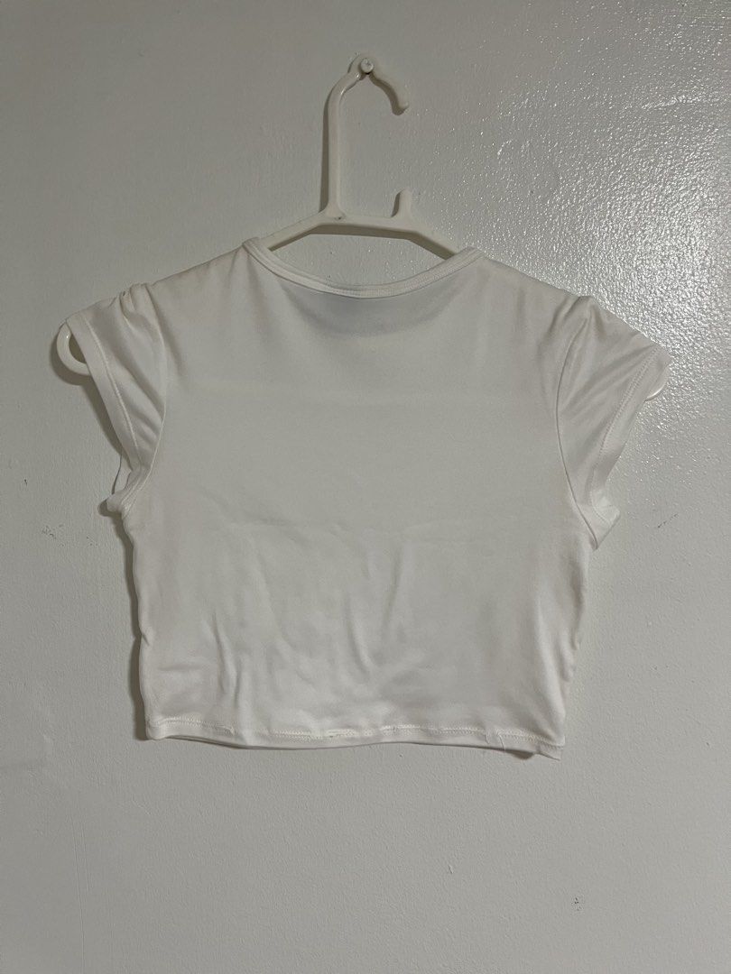 Mera White Crop Top Size S (Category: Shirts) located in Cabuyao City. Submitted by rdtrmt (Listing ID 1470743236, Image 3). Description: - Brand: Mera - Size: Small - Color: White - Style: Crop top with round neckline and plain back - Details: Short cap sleeves with structured shoulders - Fabric: Clean and smooth texture - Condition: still in good condition.