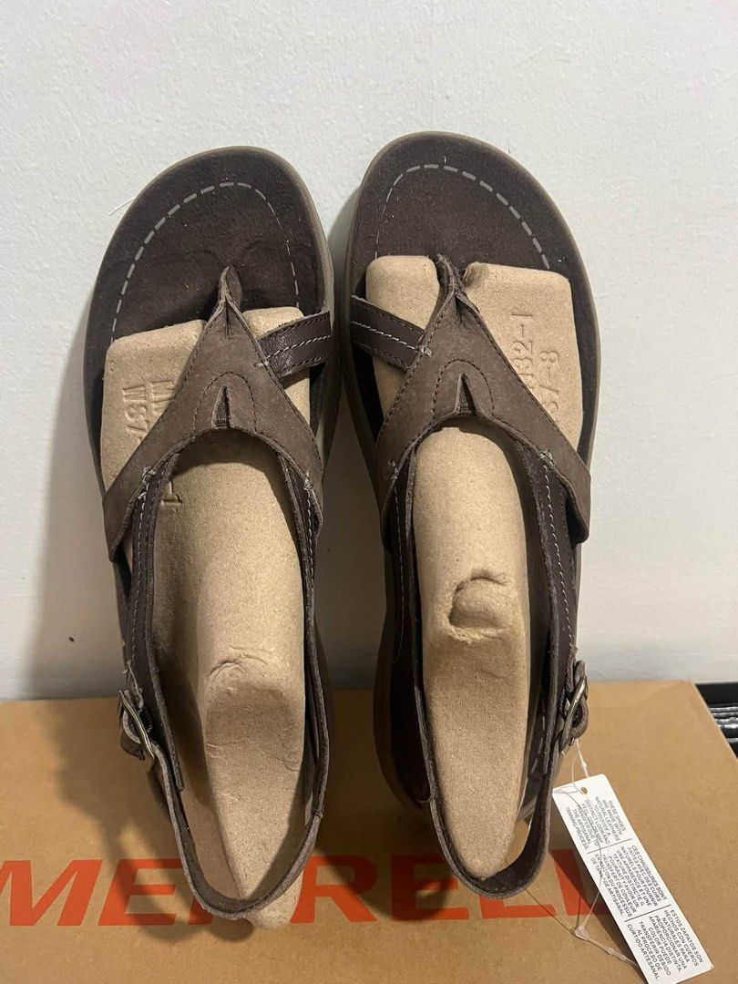 Merrell Leather Sandals Brown Slingback Thong (Category: Flats & Sandals) located in Baguio. Submitted by heath2600 (Listing ID 1470590699, Image 1). Description: - Brand: Merrell - Material: Genuine leather in rich brown - Style: Thong sandal with supportive slingback strap and adjustable buckle - Design: Classic stitched detailing around the footbed edge - Condition: Brand new with original cardboard shoe forms still inside - Packaging: Include