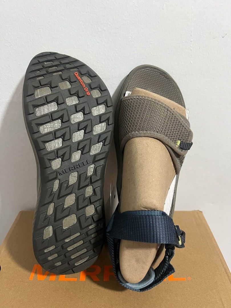 Merrell Quantum Grip Outdoor Sandals (Category: Slippers and slides) located in Baguio. Submitted by heath2600 (Listing ID 1470590324, Image 1). Description: - Brand: Merrell Outdoor Sandals - Color: Brown and navy blue strap design - Features: Mesh forefoot coverage for breathability - Outsole: Quantum Grip rubber with reliable traction patterns - Condition: Stuffed with paper inserts to maintain shape - Packaging: Comes with original shoebox - 