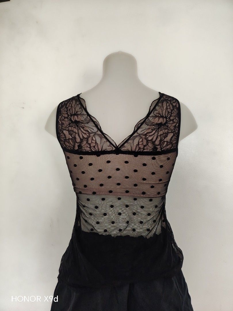 Mesh Camisole with Built-in Bra Pads (Category: Sleeveless) located in Mabalacat. Submitted by Jackikay.PreLoved (Listing ID 1470624390, Image 2). Description: - Color/Pattern: Black mesh with white/matching polka dots and nude inner lining - Details: Delicate lace trim on neckline and straps with a stylish V-neck back - Support: Includes removable hand-shaped padded inserts for a flattering push-up effect (premium chest pads!!) .