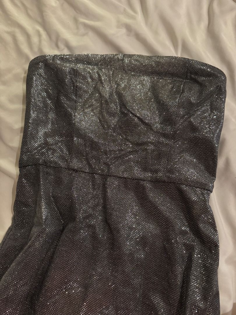 MESHKI Silver Glitter Strapless Mini Dress Size S (Category: Dresses) located in Cebu City. Submitted by _t.rix (Listing ID 1470562077, Image 2). Description: - Brand/Model: Meshki silver glitter strapless mini dress - Size: Small (S) - Features: Structured bodice with inner lining, exposed metal back zipper, and thin spaghetti straps - Finish: Textured metallic that catches the light - Condition: Worn once for a few hours, zero flaws, practicall